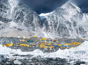 Everest Base Camp packed with colorful expedition tents beneath towering Himalayan peaks
