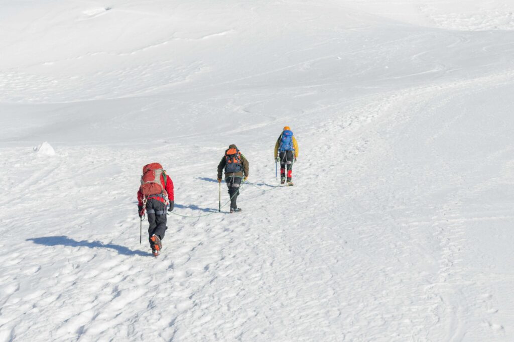 Mountaineers Climbing a Mountain in Winter
