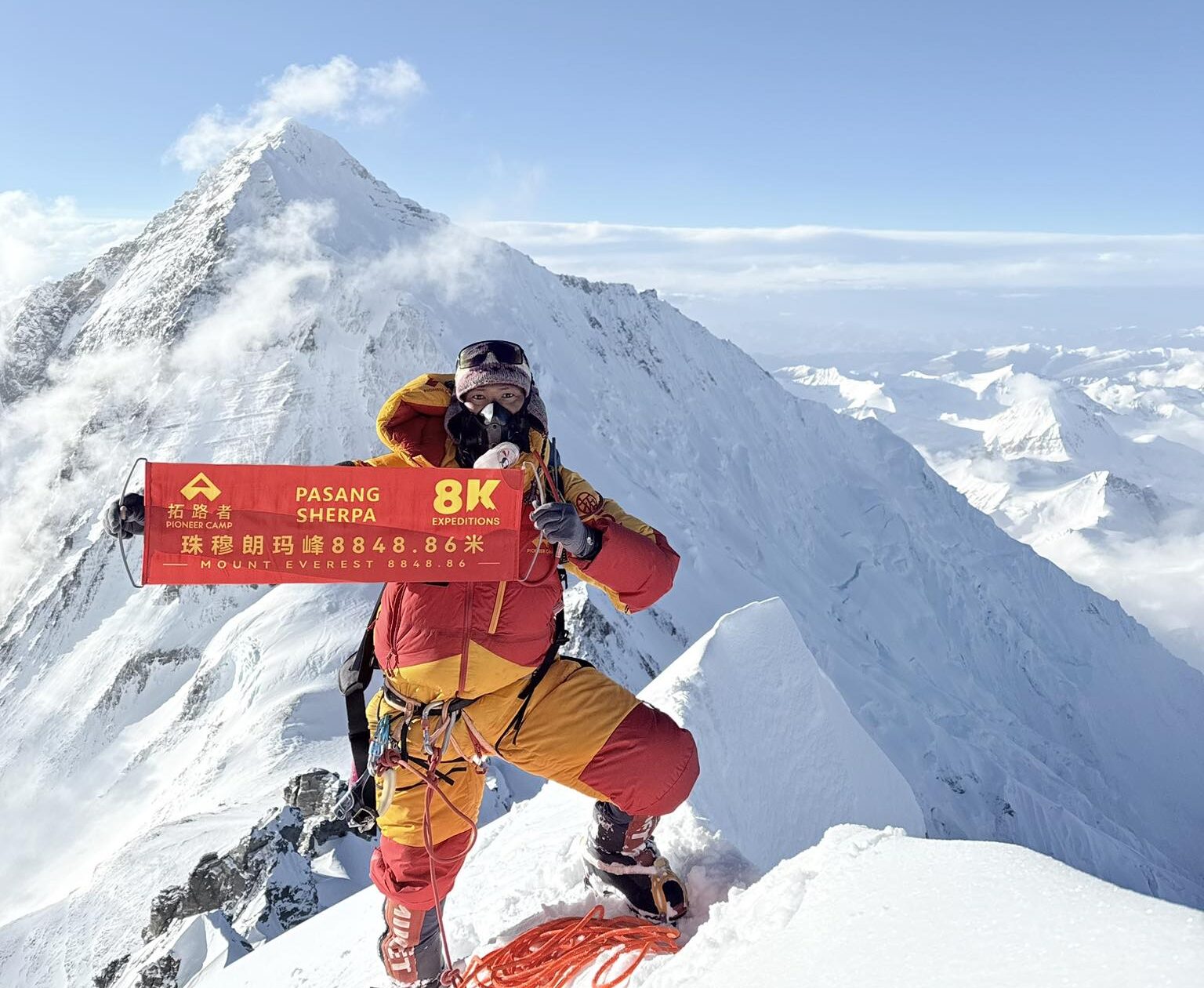 One of the Sherpa rope fixers yesterday on the summit of Lhotse, with Everest in background. Photo: 8K Expeditions