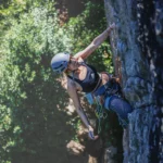Female Rock Climber Scaling a Cliff Outdoors