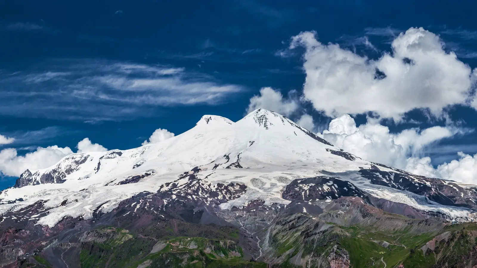 Snow Covered Mountain Under White Clouds