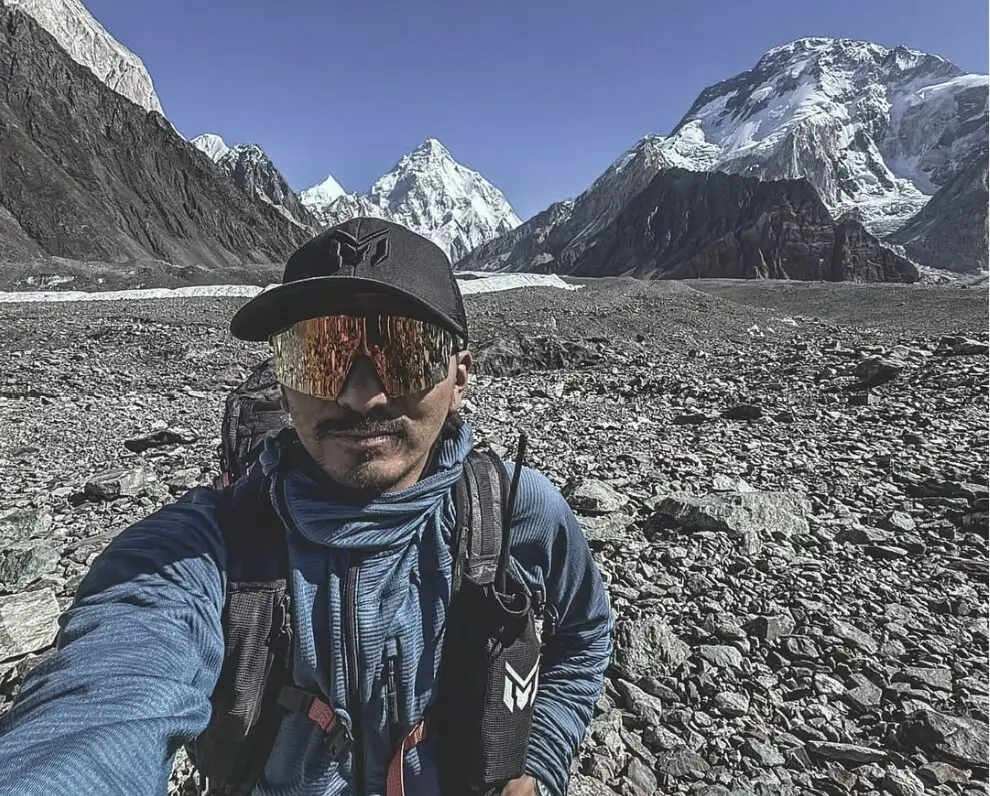 man's selfie taken in concordia with sunglasses, background mountains