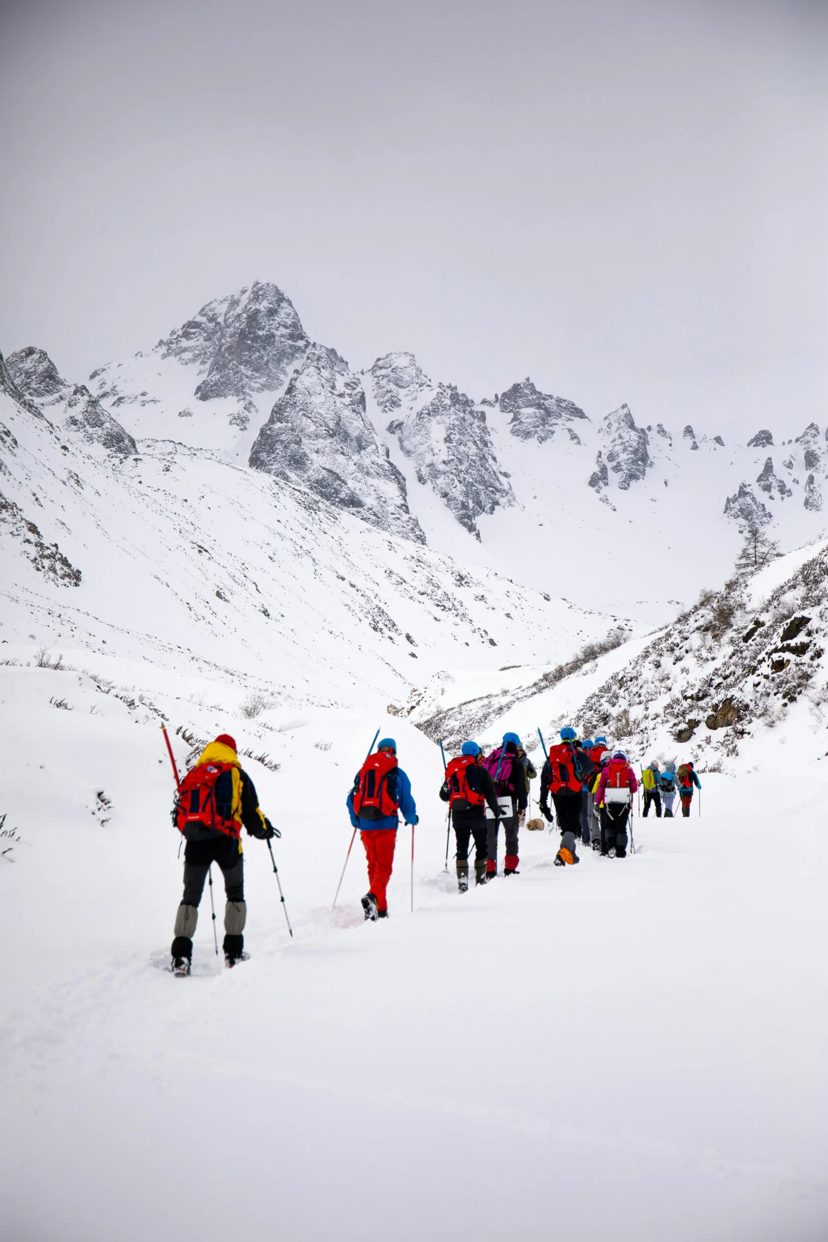 People hiking on Snow Covered Mountain